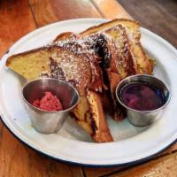 French Toast · Brioche dipped in a vanilla custard and fried to golden brown perfection. Topped with maple ...