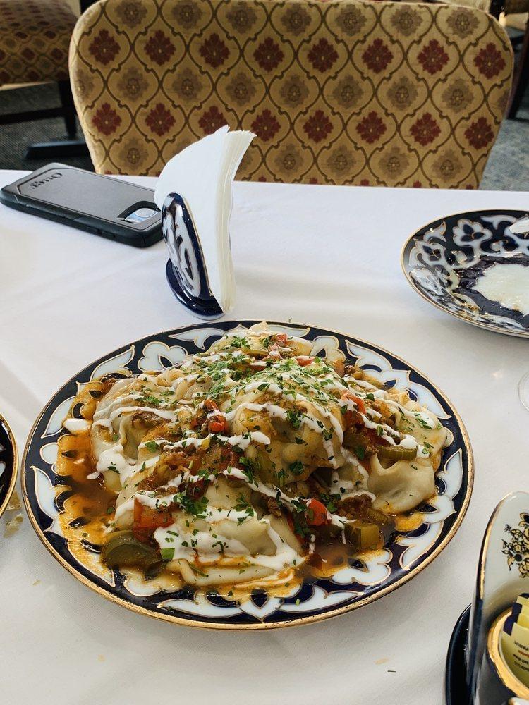 Manti · Steamed Uzbek dumplings stuffed with diced seasoned lamb, onions, and spices. Served with yogurt and a tomato-based sauce.