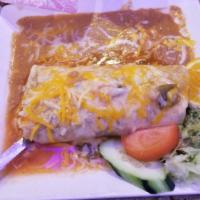 Champion Burrito · Chile relleno, grilled steak, rice and beans rolled in a large flour tortilla with ranchera ...