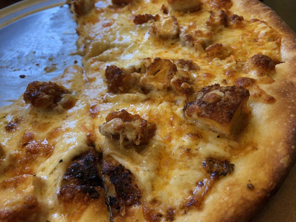 Buffalo Chicken Pizza · Breaded chunks of chicken tossed in a spicy wing sauce and bleu cheese dressing.
