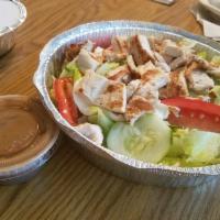 Grilled Chicken Salad · Marinated strips of char-grilled chicken, fresh mozzarella, roasted peppers, tomatoes and cu...
