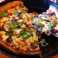 Chicago Fire Pizza · The real story behind the Fire.  Spicy sausage, sport peppers, garlic, cilantro and mozzarel...