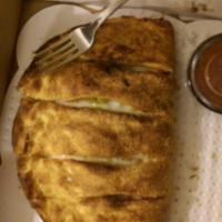 Calzone · Made to order with homemade pizza dough, stuffed with the freshest ingredients, then folded ...