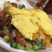 Breakfast Club Skillet · Bacon,Ham, Sausage or Chorizo, Roasted Potato & Vegetables Topped with 2 Eggs your way and C...