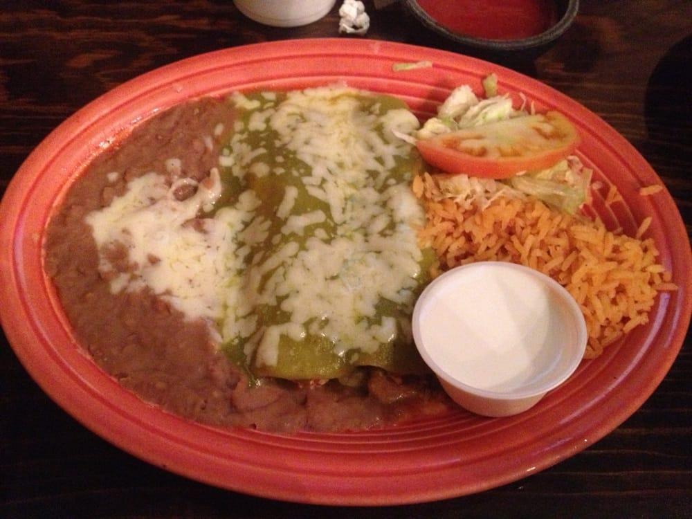 Enchiladas Verdes · 2 shredded chicken enchiladas topped with a green special sauce and sour cream.