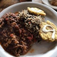 Ropa Vieja · Cuban style shredded beef. Beef roasted in salsa criolla sauce served with moro and tostones...