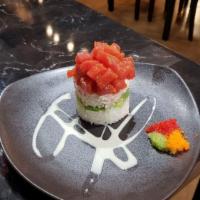 Ahi Tower · Spicy tuna chunks, avocado, crab mix, sushi rice, masago, creamy wasabi sauce.