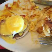 Eggs Benedict · 2 poached eggs and Canadian bacon over English muffin, topped with hollandaise sauce.