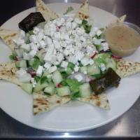 Greek Salad · Lettuce, feta, Kalamata olives, onions, peppers, cucumbers, scallions, radish, anchovies, st...