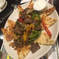 Beef Gyro Platter · Served with sauteed peppers and onions, served over rice with tzatziki sauce and pita.
