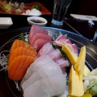 Chirashi · 15 pieces of fish assortment, 1 piece shrimp and 1 piece tomago over a bed of sushi rice.