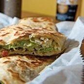 Chicken Quesadilla · Marinated chicken strips seasoned and grilled, placed in a flour tortilla filled with melted...