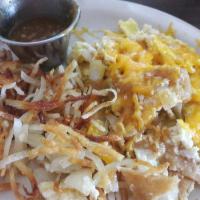 Migas · Cut up corn or flour tortilla mixed with a scrambled egg, onions and cheese. Comes with your...