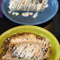 Barrio Pollo Burrito · Spiced-rubbed chicken, caramelized onions and roasted poblano peppers in our spicy cream sau...