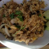 Pineapple Fried Rice · Choice of meat or tofu stir-fried with rice, egg, pea and carrot, raisin, pineapple, cashew ...