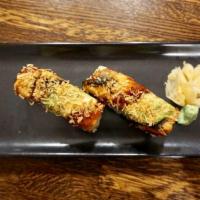 Black Dragon Roll · Crab meat, shrimp inside and grilled eel and avocado on top with eel sauce and crunch. 