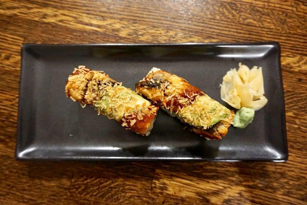 Black Dragon Roll · Crab meat, shrimp inside and grilled eel and avocado on top with eel sauce and crunch. 