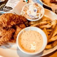 Crispy Chicken Strips · Cooked golden and served with fries and zesty coleslaw. Served with choice of sauce: ranch, ...