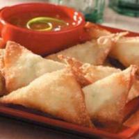 6 Piece Crab Rangoon · home make ,crab meat with cream cheese in wonton skins deep fried and served with a sweet so...