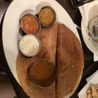 Masala Dosa · A golden crispy rice and lentil flour crepe, stuffed with spiced potatoes masala served with...