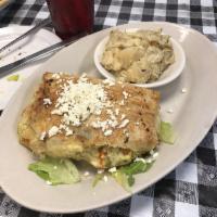 Kotopita · Baked cubes of chicken, Feta cheese and veggies in flaky filo pastry.