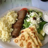 Gyro Platter · A hot seasoned lamb and beef gyro. Served with greek salad, pita, homemade tzatziki, greek d...