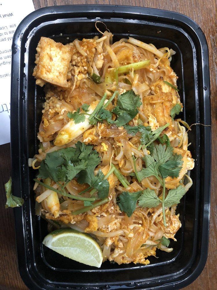 Pad Thai · Stir-fried rice noodles, eggs, bean sprouts, green onions and cilantro topped with ground peanut.