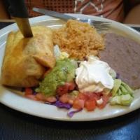 Chimichanga · Large flour tortilla filled with beef or chicken, beans and cheese, deep fried and served wi...