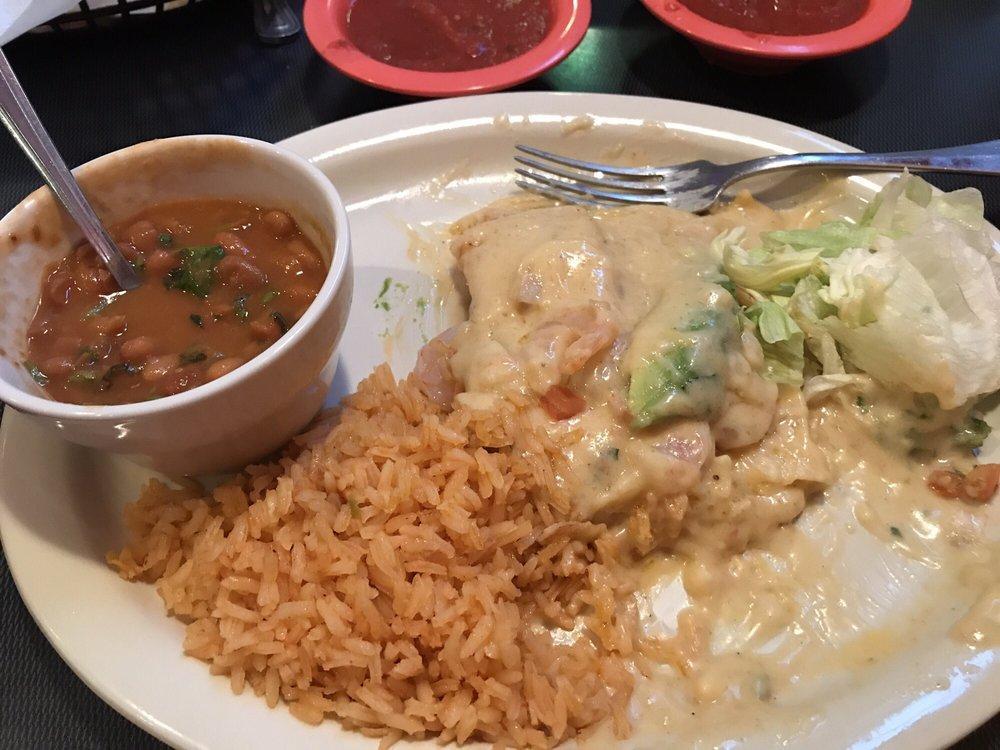 Seafood Enchiladas · 2 cheese enchiladas topped with shrimp, seafood sauce and slices of fresh avocado. Served with Spanish rice and beans.