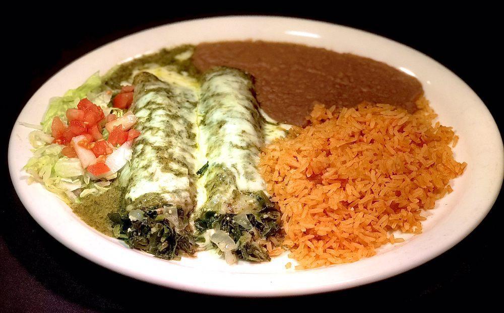 Spinach Enchiladas · 2 spinach and mushroom enchiladas topped with Monterrey Jack cheese and creamy spinach sauce. Served with Spanish rice and beans.