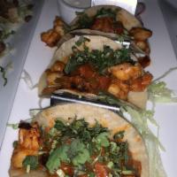 Shrimp Tacos · Shrimp sauteed in tomatoes, olives and fresh oregano garnished with cilantro and a side of s...