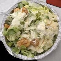 Caesar Salad · Romaine lettuce tossed with our homemade Caesar dressing, topped with croutons and pecorino ...