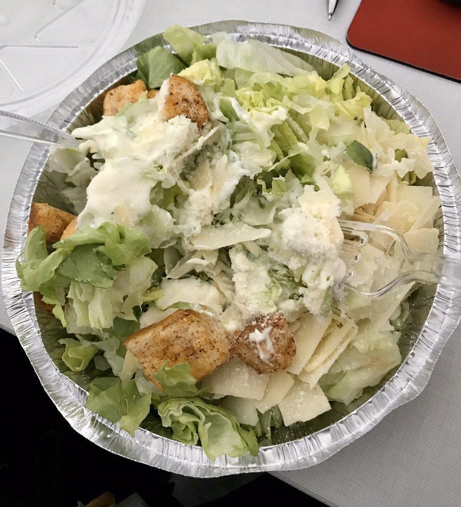 Caesar Salad · Romaine lettuce tossed with our homemade Caesar dressing, topped with croutons and pecorino Romano cheese.