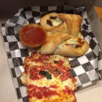 Sausage and Pepper Roll · Pizza dough rolled with fresh Italian sausage, green peppers, onions, tomato sauce and mozza...