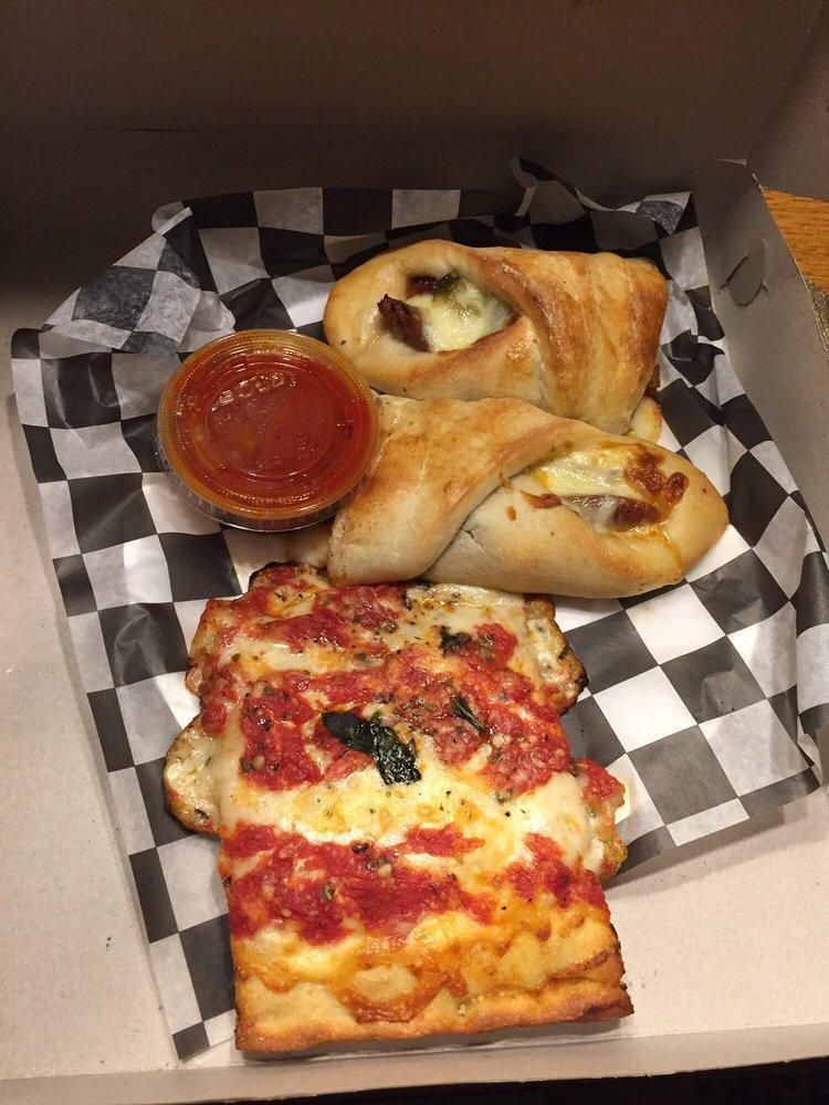 Sausage and Pepper Roll · Pizza dough rolled with fresh Italian sausage, green peppers, onions, tomato sauce and mozzarella cheese.
