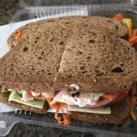 Turkey Sandwich · Sliced Turkey Breast, mayo, tomatoes, cheese, carrots, lettuce, olives, mustard, onions, ban...
