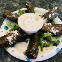 Dolmas · Rice, parsley, mint, and lemon juice wrapped in grape leaves.