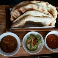 Chili Cheese Kulcha · 2 pieces. Traditional flatbread made in our tandoor, stuffed with cheddar and chilis. 2 piec...