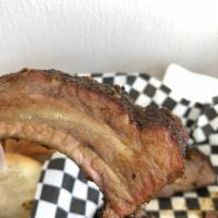 Pork Ribs · Seasoned overnight and smoked onsite daily, our pork ribs are artfully crafted and simply de...