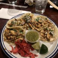 Street Tacos · 5 traditional corn tortilla tacos filled with your choice of steak, grilled chicken or pork ...