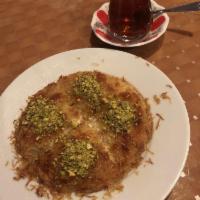 Kunefe · Heavenly dessert made with sweet cheese layered between shredded Kadayif dough drizzled with...