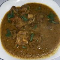 Goat Curry · Fresh goat meat cooked with onions, fresh
ginger, garlic and spices.
