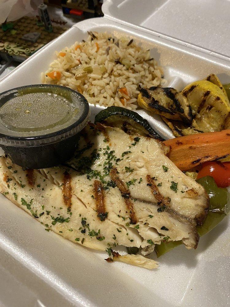 Grilled Tilapia · Served with rice and grilled veggies.