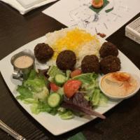 Falafel Plate · Combination of chickpeas, garlic, jalapeno, parsley, and spice. Served with rice, garden sal...