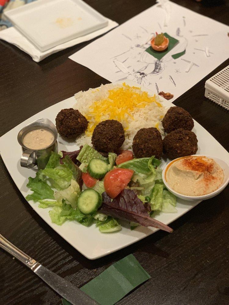 Falafel Plate · Combination of chickpeas, garlic, jalapeno, parsley, and spice. Served with rice, garden salad, hummus, and pita.