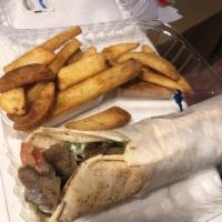 Gyro Wrap · Combination of beef and lamb with lettuce, tomato, pickle and tzadziki sauce. Served with ga...