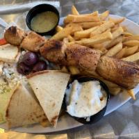 Chicken Souvlaki Platter · Marinated grilled chicken breast souvlaki served with  Greek salad, pita bread, tzatziki and...