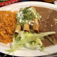 Flauta Plate · Three rolled crispy tacos with lettuce, salsa, avocado, cheese and crema. Served with rice a...