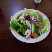 Greek Salad · Romaine lettuce, tomatoes, cucumbers, onions, Kalamata olives and feta cheese with our homem...