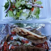 Gyros Wrap · Sliced lamb wrapped with tomato, onion and tzatziki sauce. Served with a choice of side.